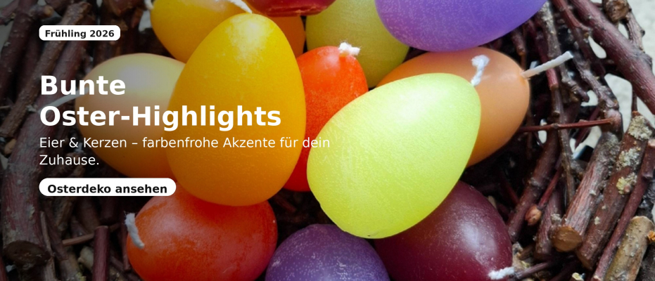 Bunte eiförmige Kerzen in kräftigen Farben, arrangiert in einem rustikalen Weiden-/Reisignest als farbenfroher Osterakzent. Tolle Osterdekoration.